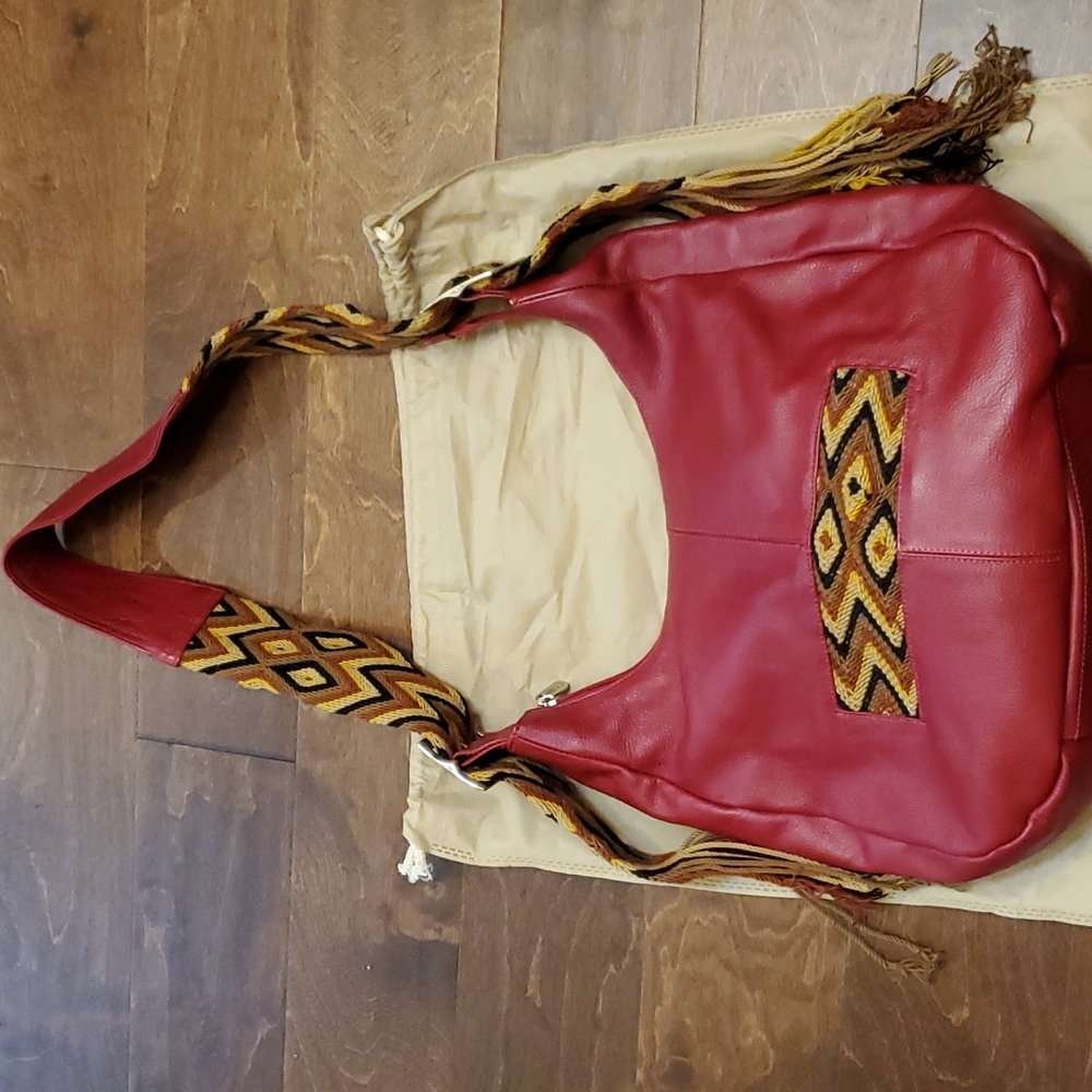 Genuine leather red unique handbag.